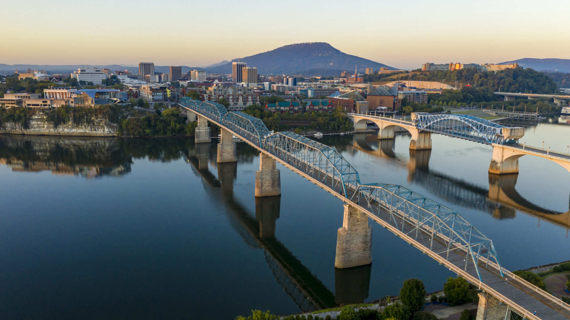Sunrise comes to Lookout Mountain standing behind Downtown Chattanooga Tennessee The Tennessee River winds around the banks of downtown Chattanooga TN at dawn